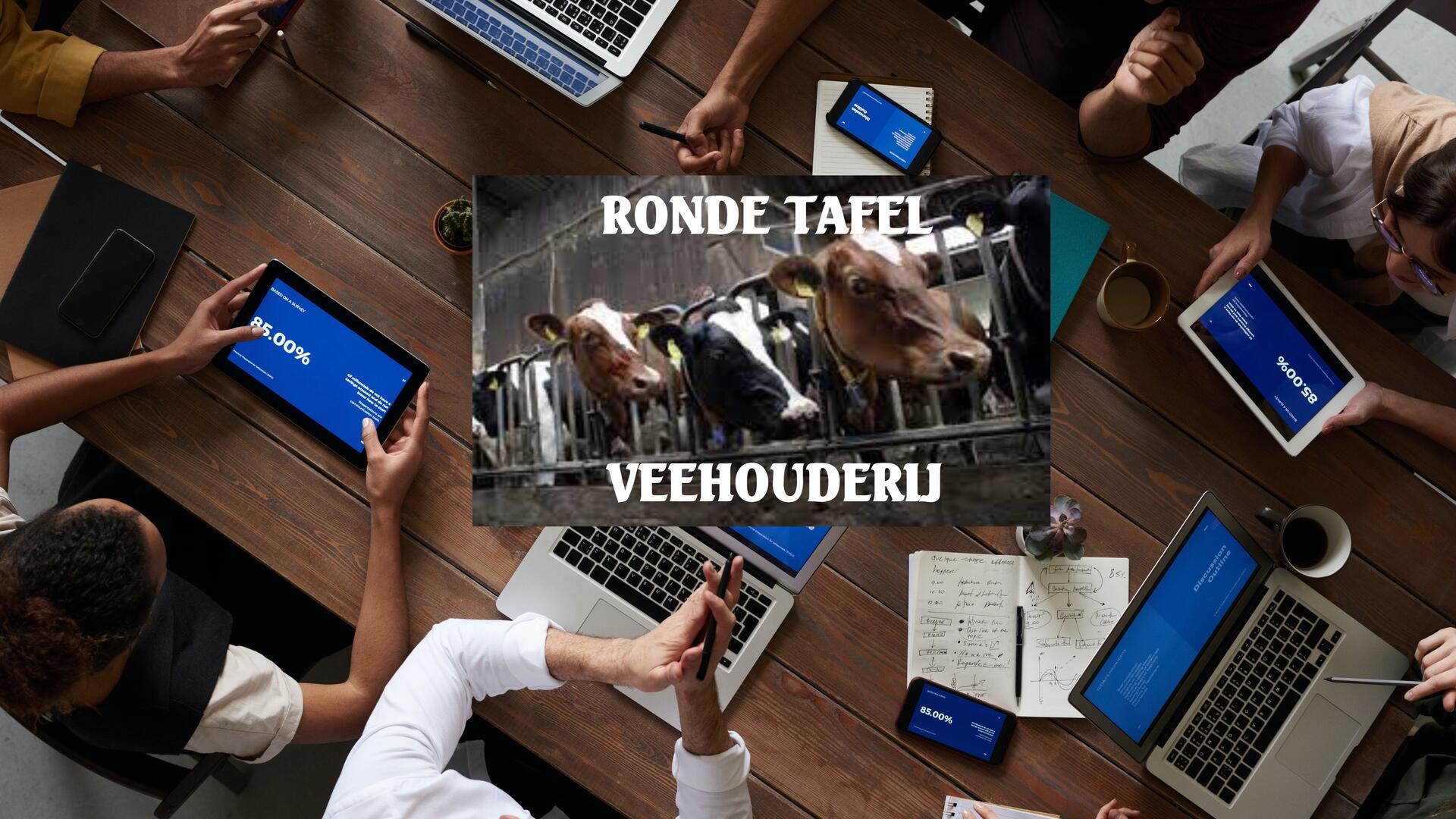 mensen aan tafel in gesprek over veehouderij